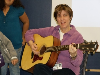 Cynthia Haring Playing Guitar